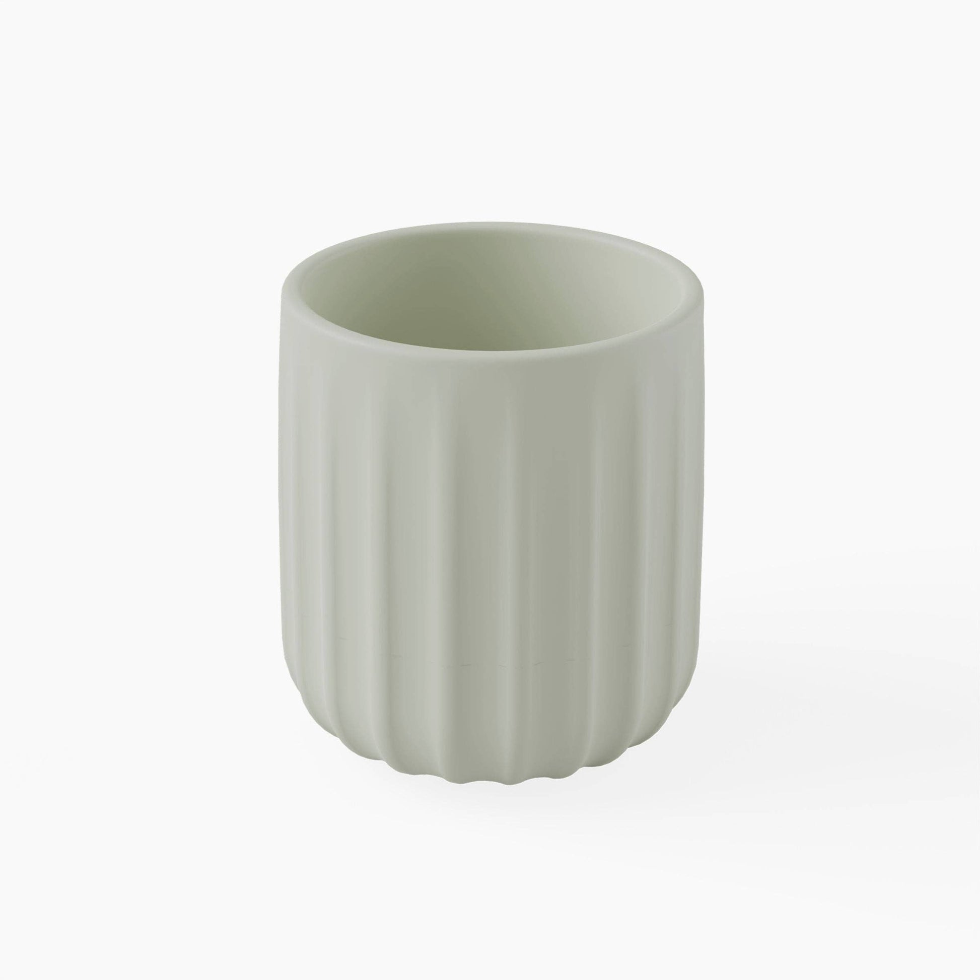 Green silicone cup with ribbed texture on a white background