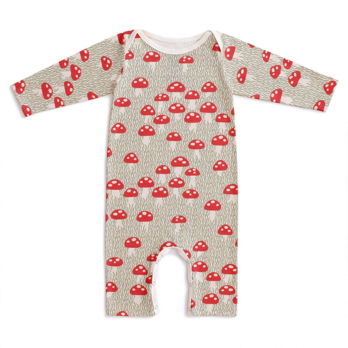 A baby long-sleeve footless romper with an all-over red mushroom print on a textured beige background, shown flat against a white background.