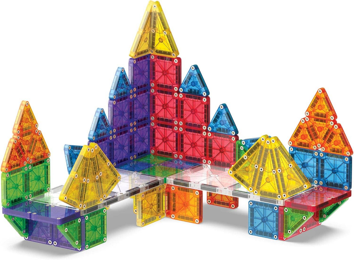 Colorful magnetic building blocks forming a castle-like structure on a white background