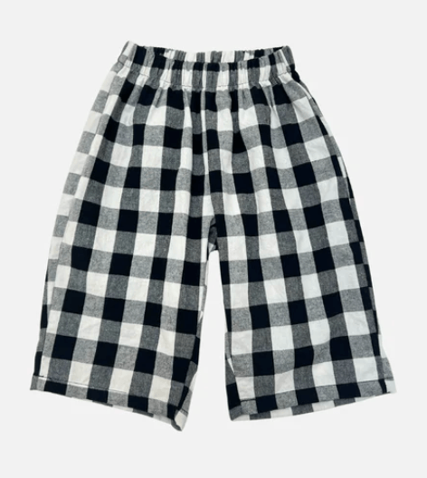 Black and white checkered pants on a light gray background