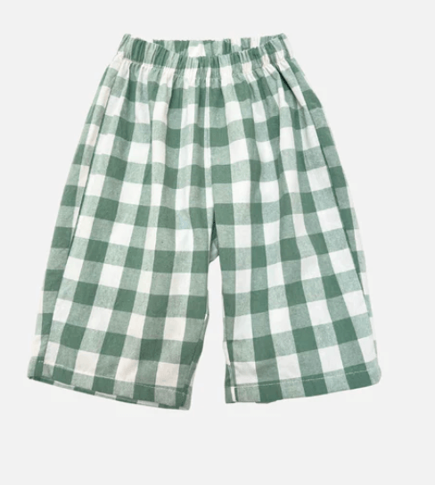 Green and white checkered toddler pants on a light gray background