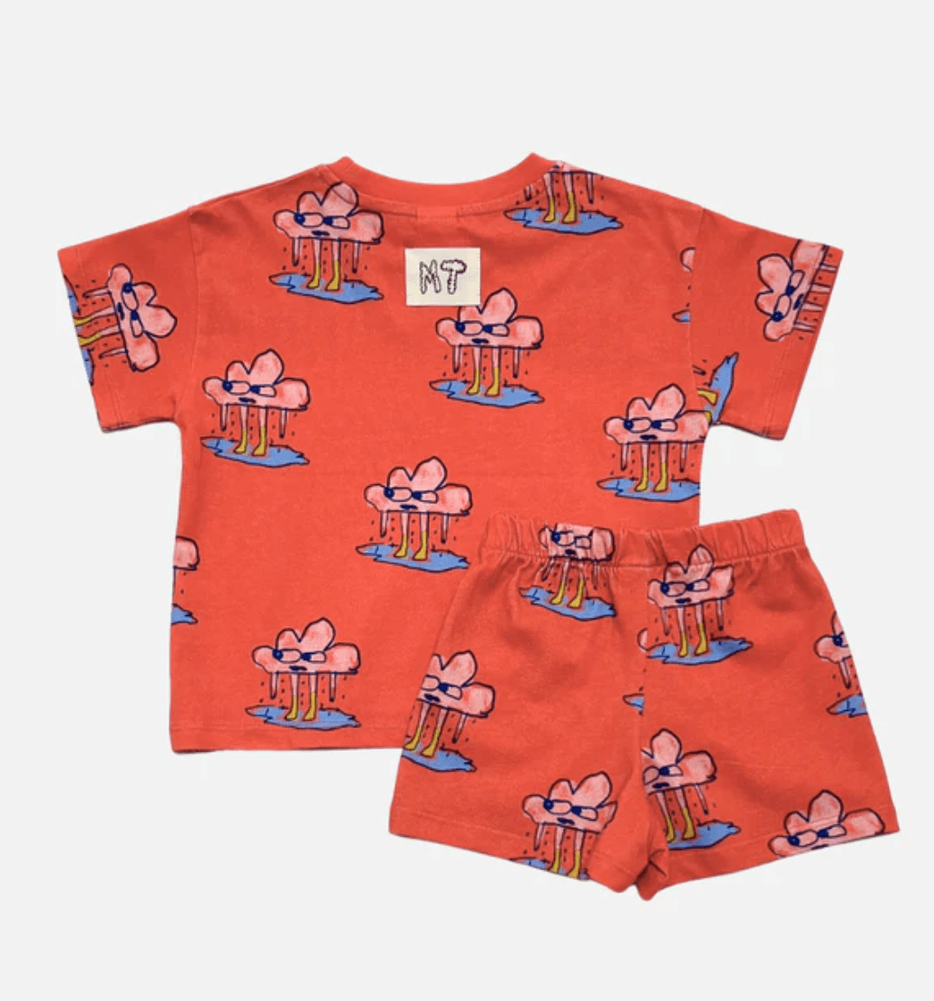 Red children's t-shirt and shorts set with cartoon character pattern on a white background