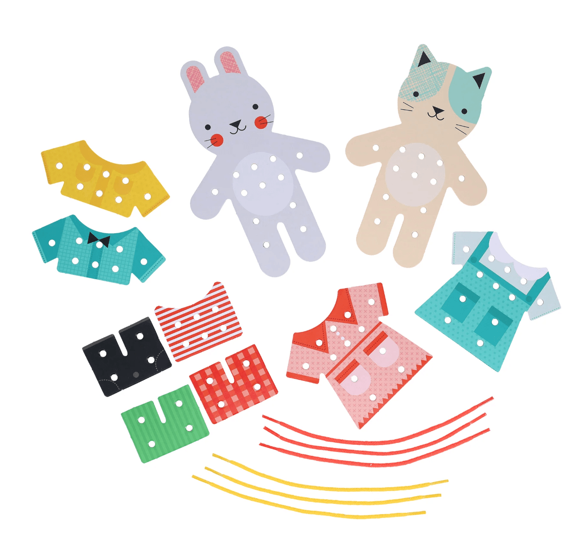 Set of colorful clothing pieces for toy animals on a white background