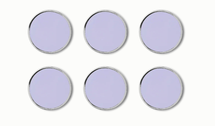 Six round light purple magnets with silver metal rims, arranged in two rows of three on a plain white background.