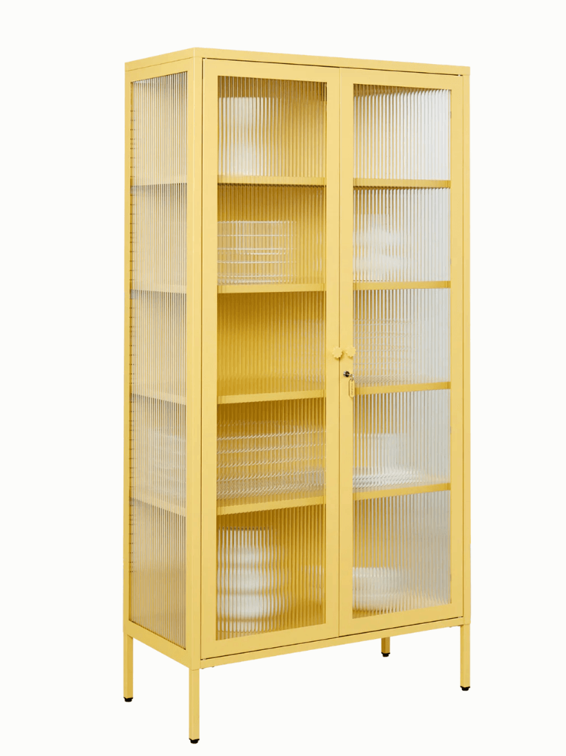 A tall yellow metal cabinet with two ribbed glass doors and five interior shelves, shown on a plain white background.