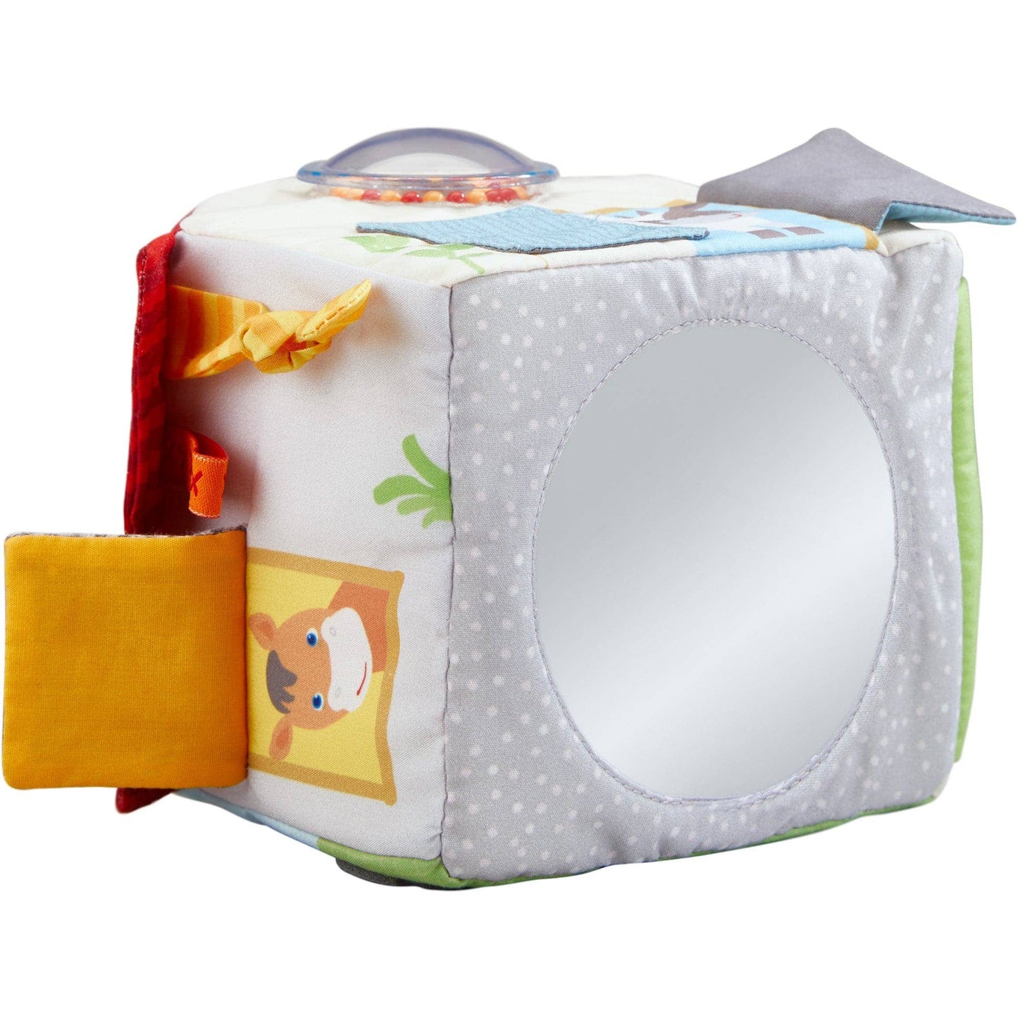 Colorful baby toy cube with various textures and sounds on a white background