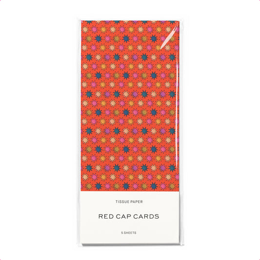 Pack of tissue paper with colorful star pattern on a white background