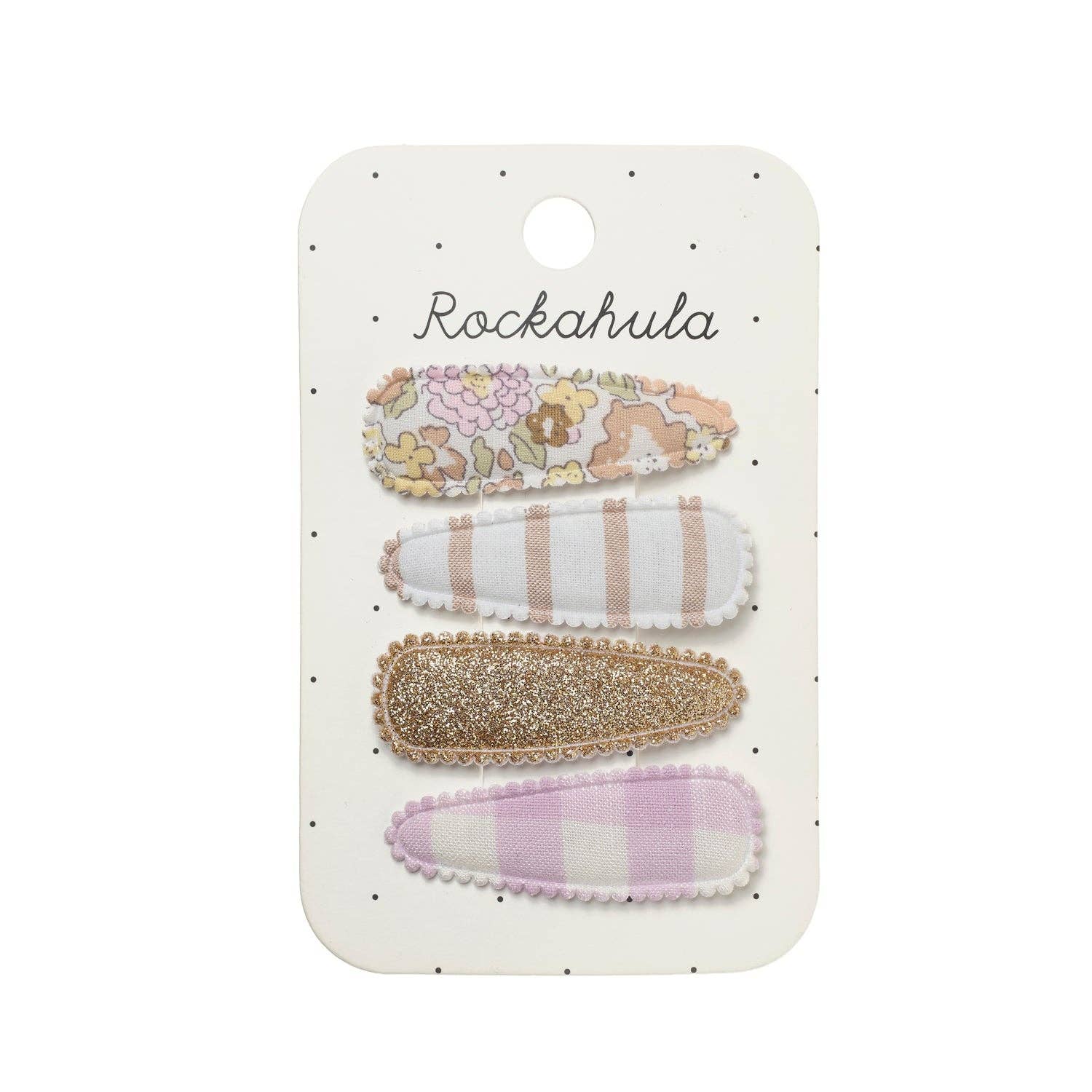 Four fabric hair clips in pastel colors, including floral, striped, glitter, and gingham patterns, attached to a white card labeled 'Rockahula'.