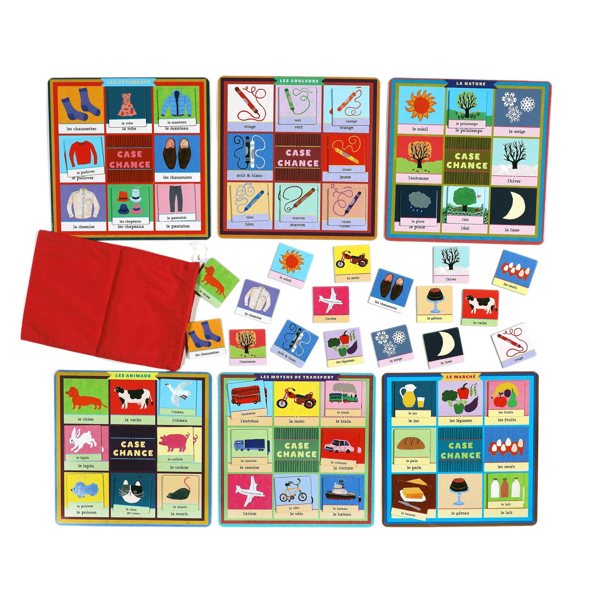 Collection of educational card games with colorful cards and a red cloth on a white background