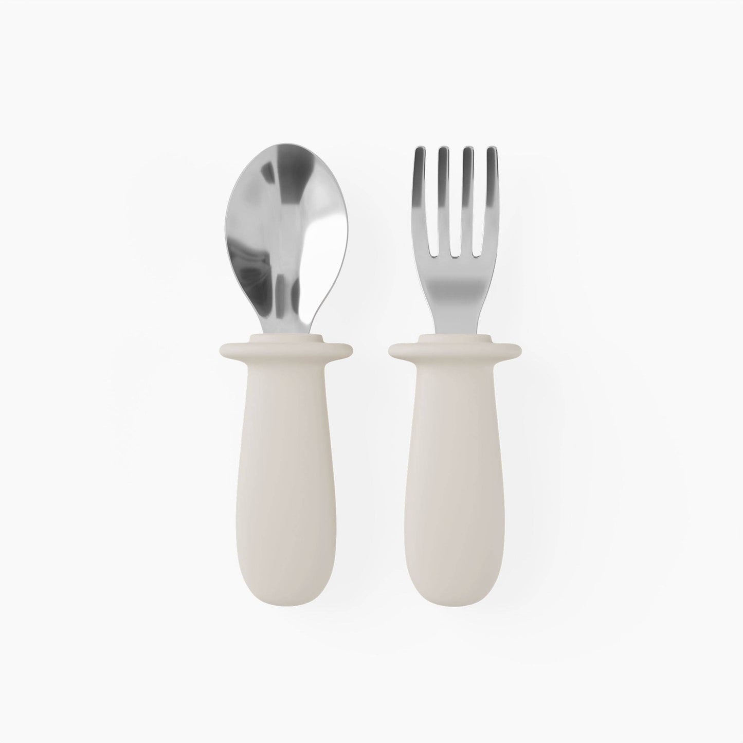 Set of silver spoon and fork with white handles on a white background