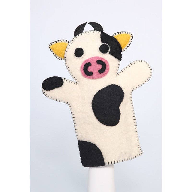 Cow-shaped hand puppet on a white background