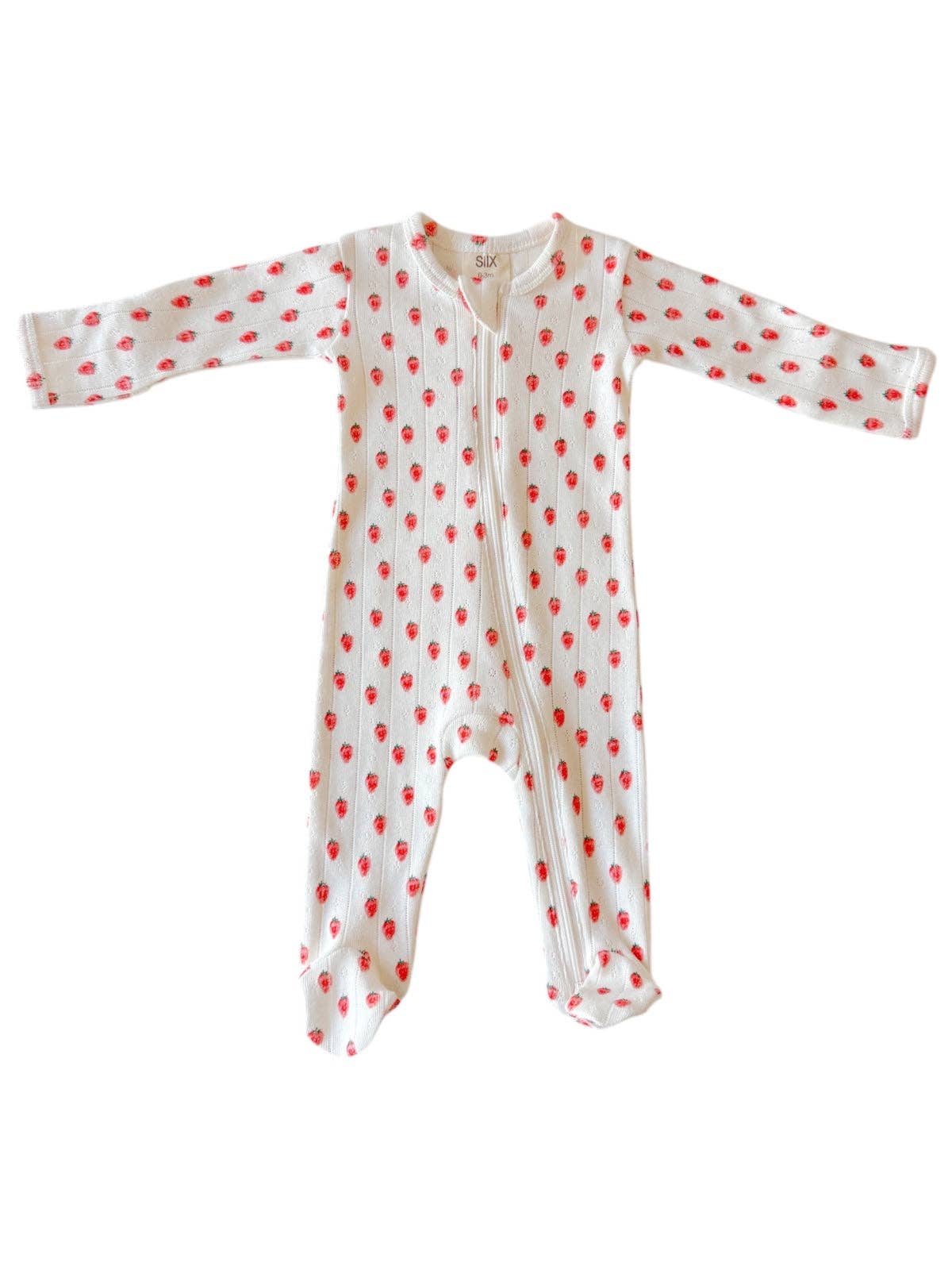 White baby onesie with red strawberries on a white background