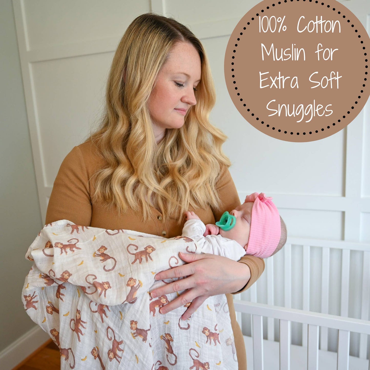 Woman holding a baby wrapped in a cotton muslin blanket with text about its softness.
