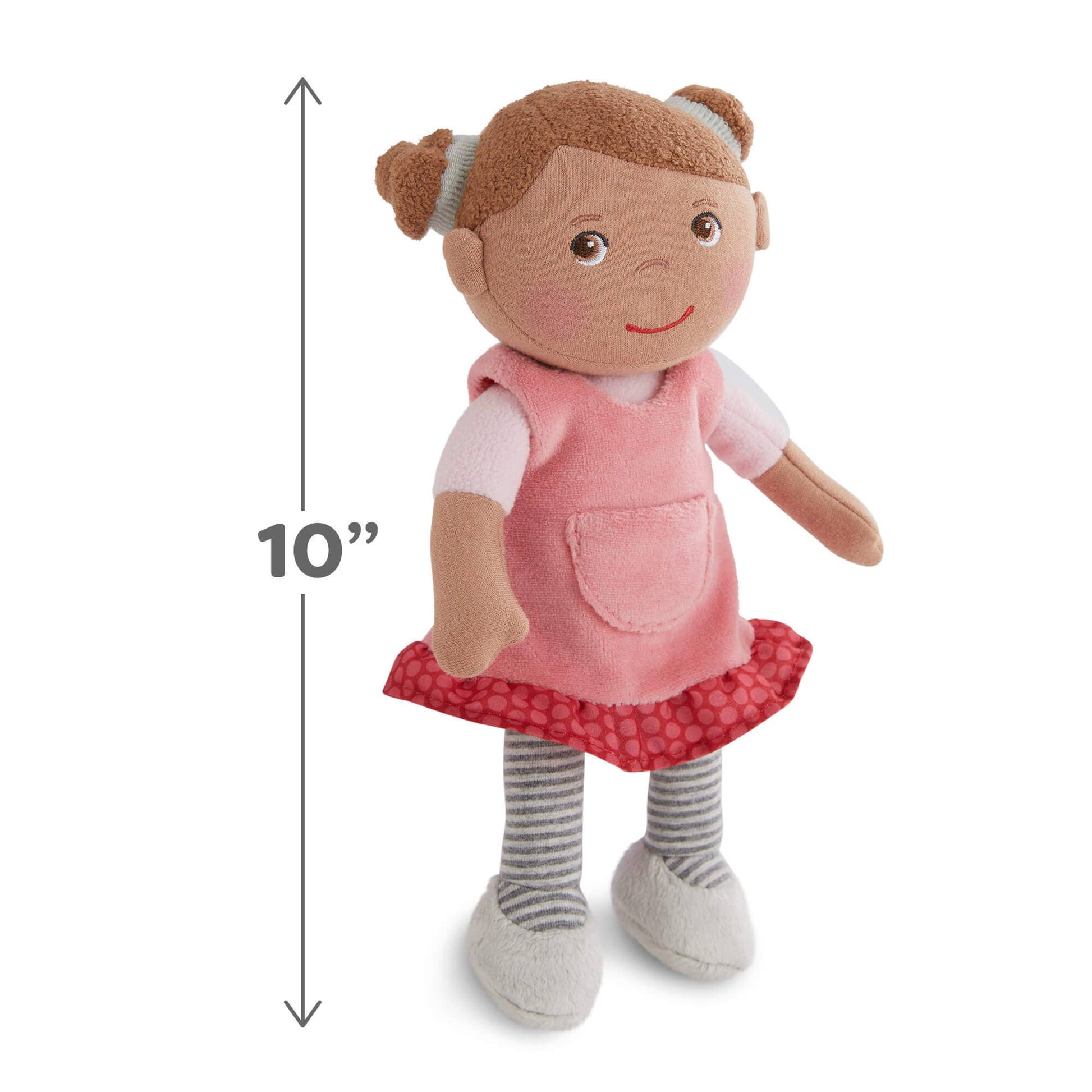 Stuffed doll with a pink dress and red skirt, standing next to a 10-inch measurement marker on a white background.
