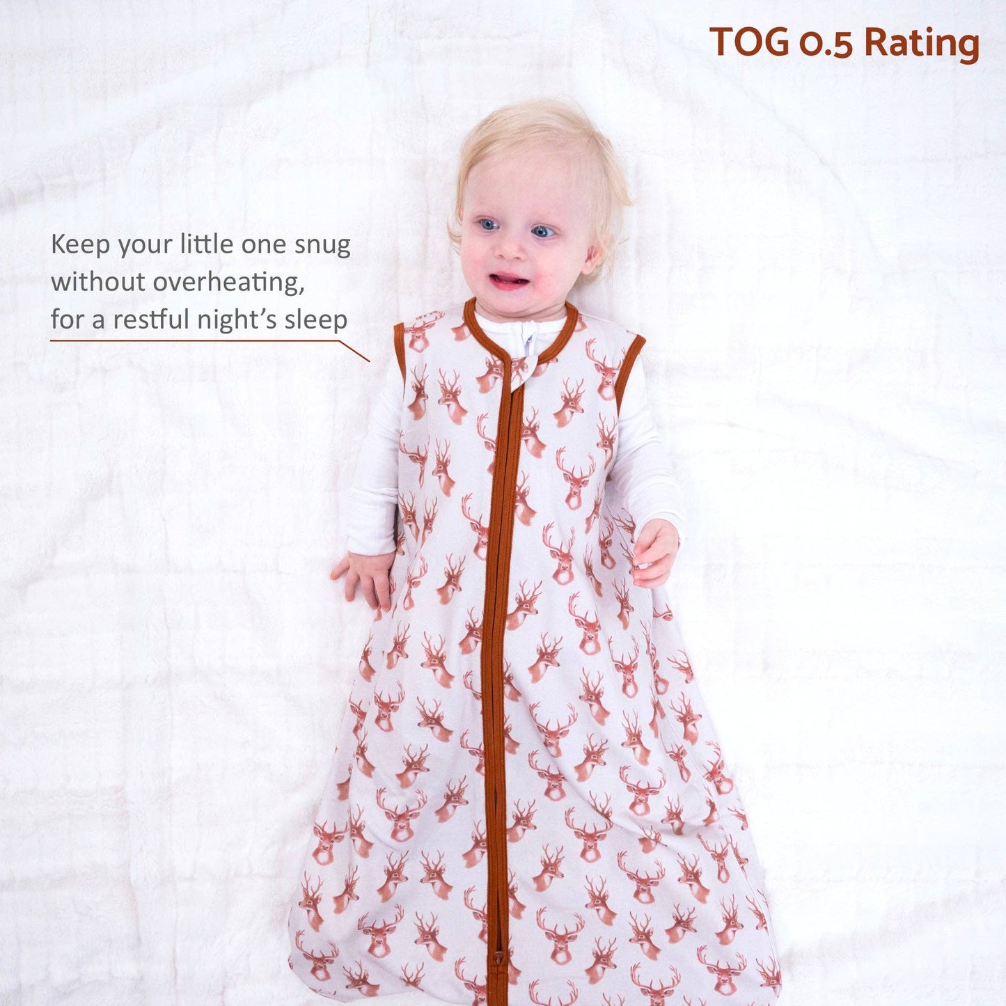 Child wearing a patterned sleep bag with text about its temperature rating on a white background