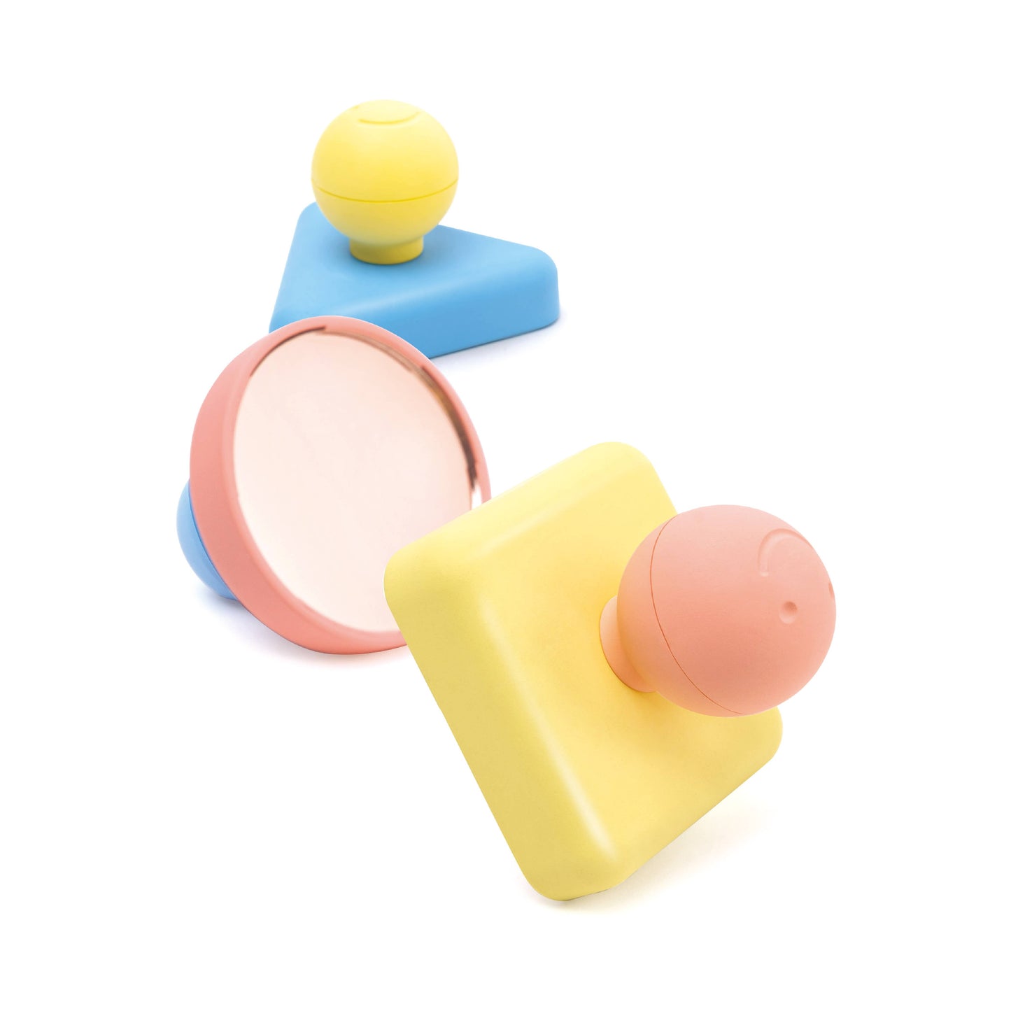 Colorful geometric toys on a white background