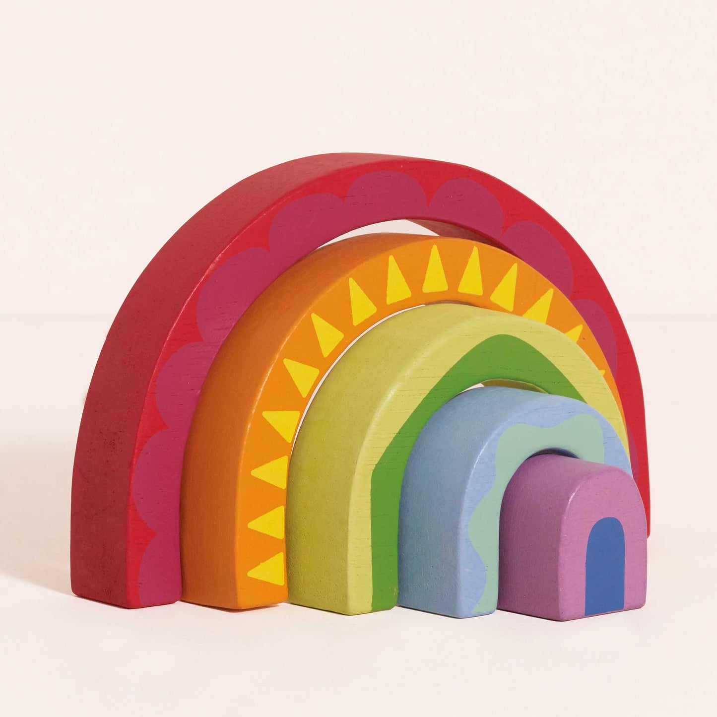 Set of colorful wooden arches on a light pink background