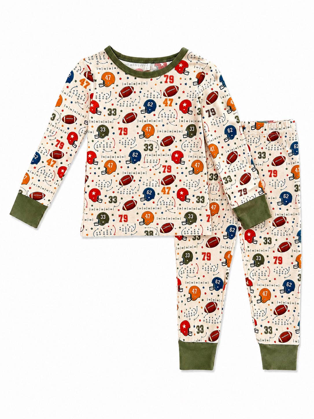 A two-piece children's pajama set featuring a long-sleeve top and matching pants. The pajamas have an off-white background with an all-over football-themed print including red, blue, green, and orange footballs, helmets, numbers, and small logos.