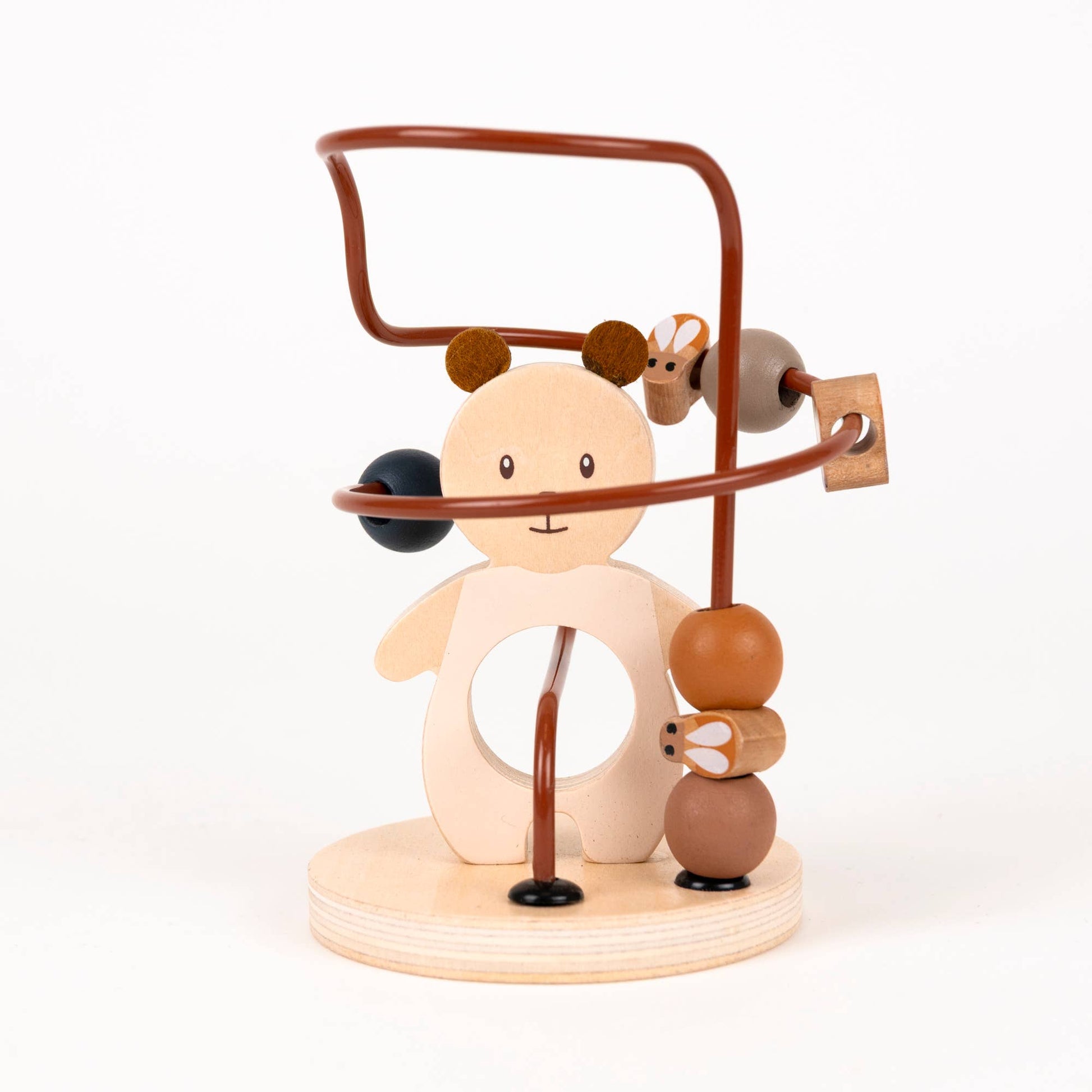 Wooden toy with a bear figure and various circular elements on a white background