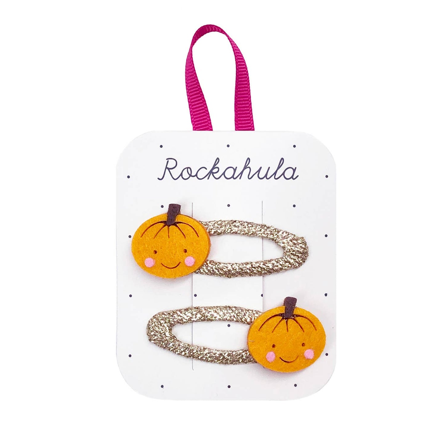 Set of hair clips with pumpkin designs on a Rockahula branded card.