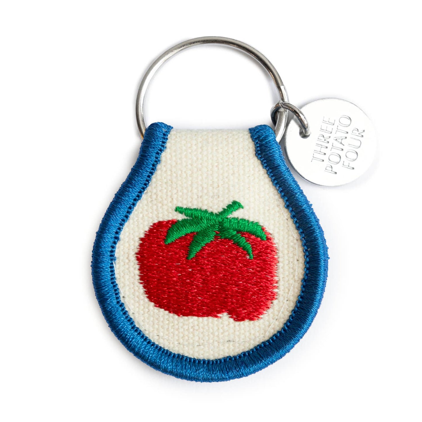 Keychain with embroidered tomato design on a white background