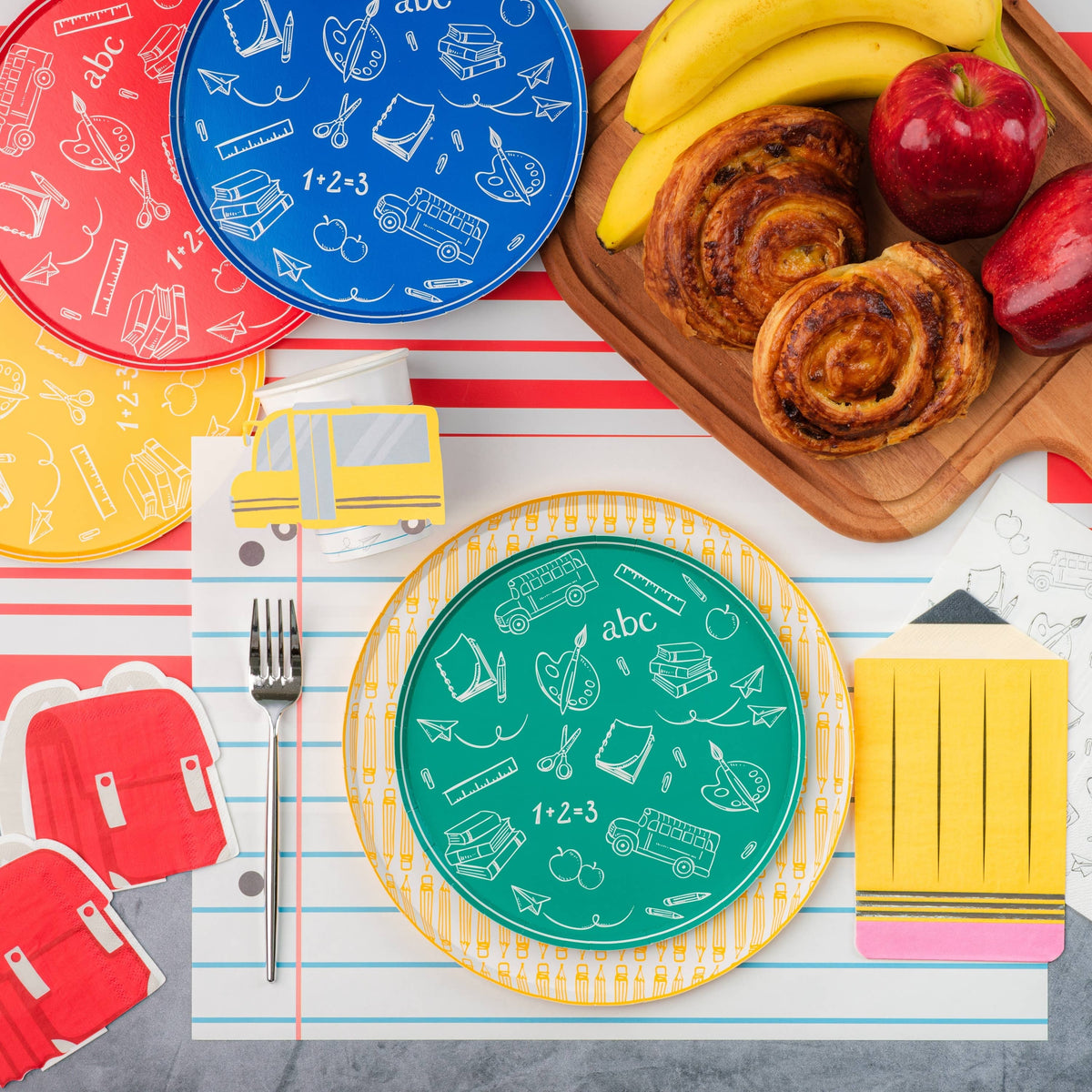 A back to school tablescape with a placemat made to look like a sheet of notebook paper.