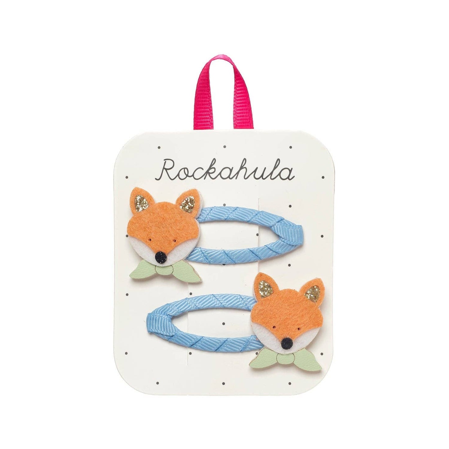 Fox-themed hair clips on a Rockahula branded card with pink handle.