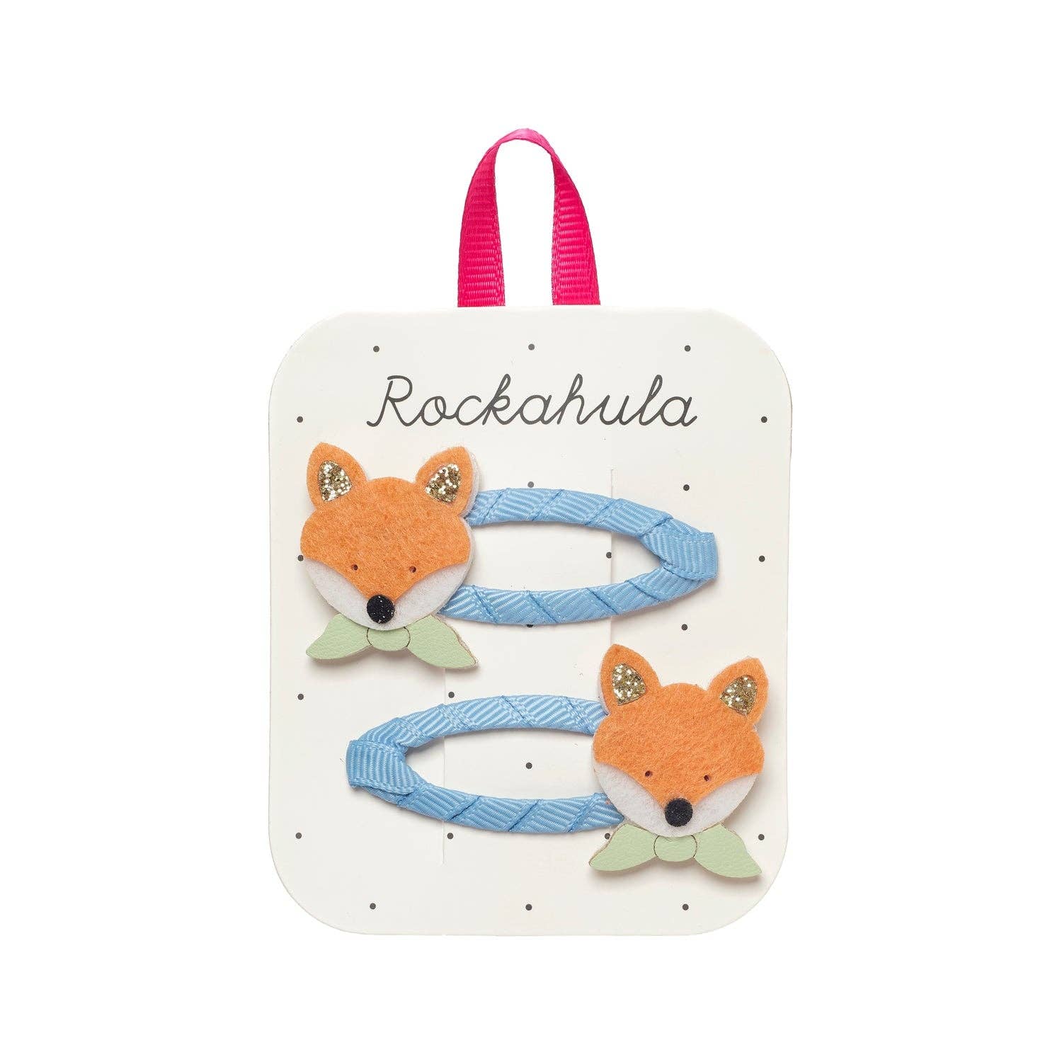 Fox-themed hair clips on a Rockahula branded card with pink handle.