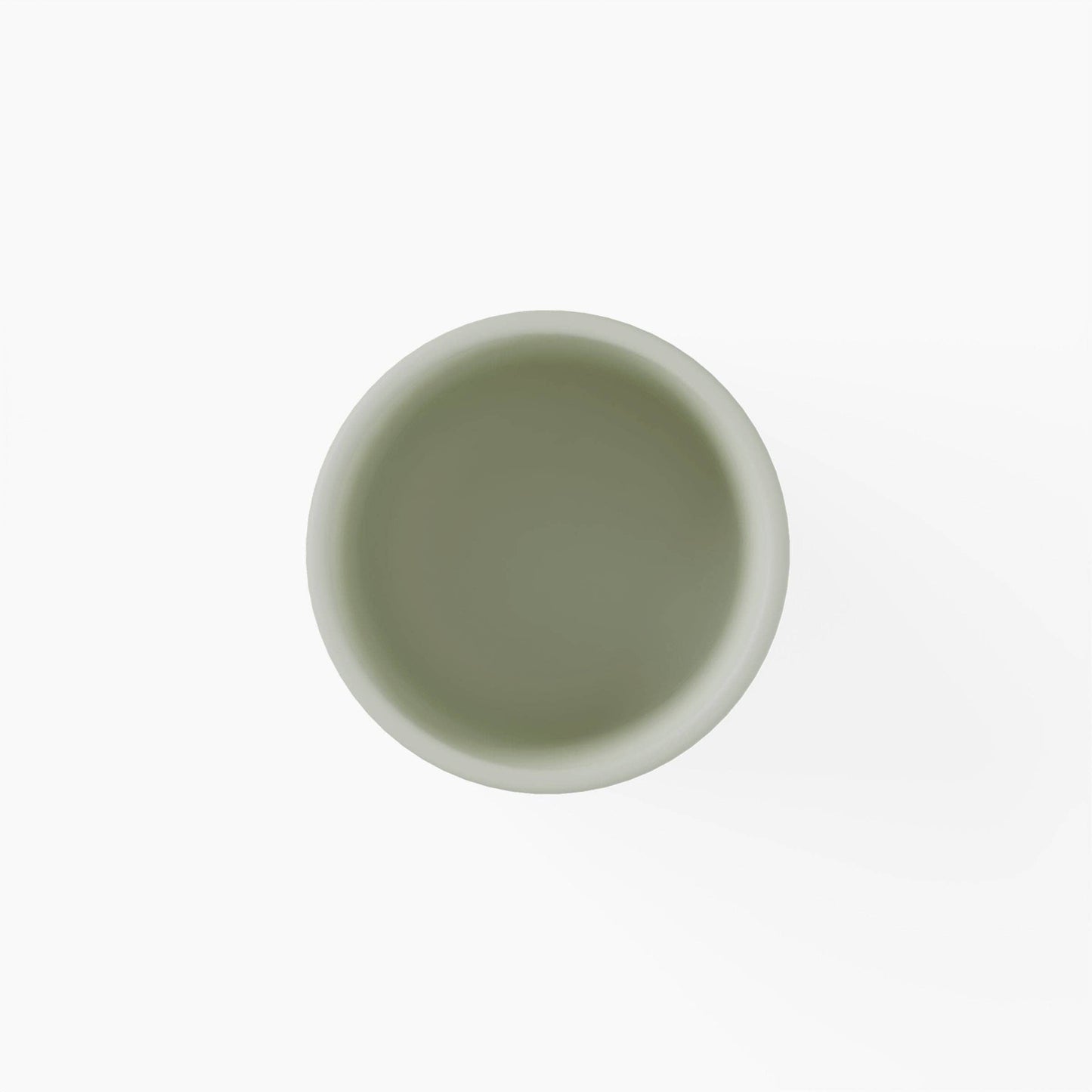 Top view of a green silicone cup on a white background