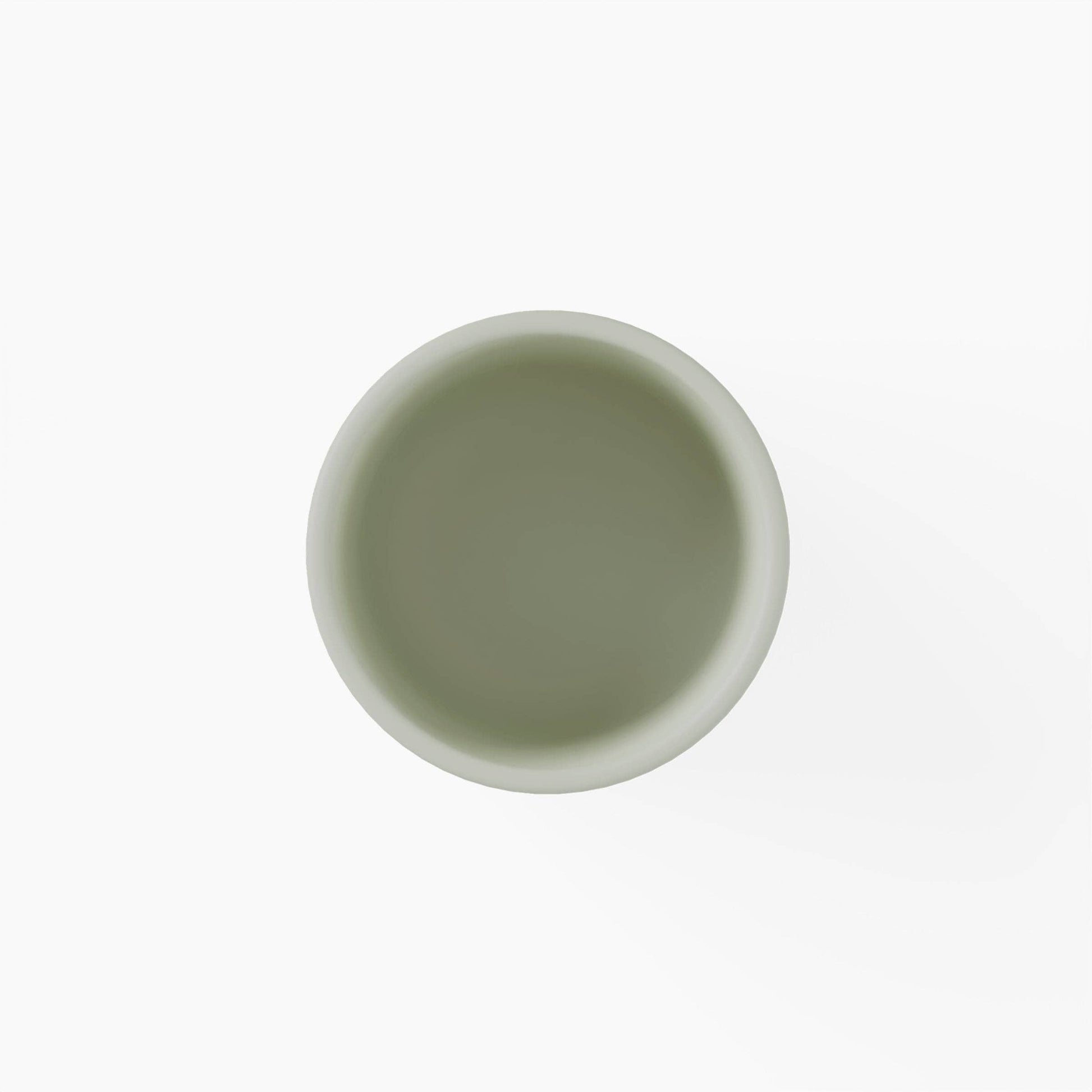 Top view of a green silicone cup on a white background