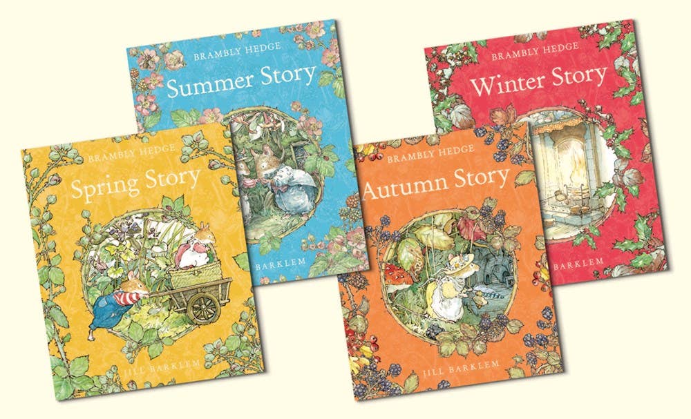 Four children's books titled 'Spring Story', 'Summer Story', 'Autumn Story', and 'Winter Story' by Brambly Hedge on a white background.
