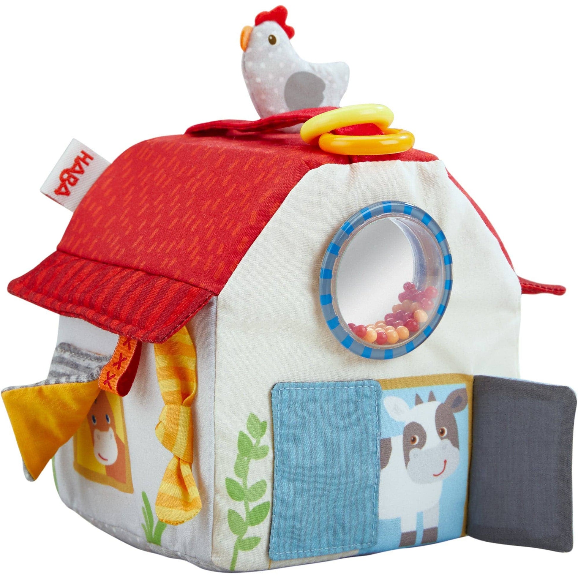 Children's toy house with farm animal designs and a chicken on top, featuring the HABA brand.