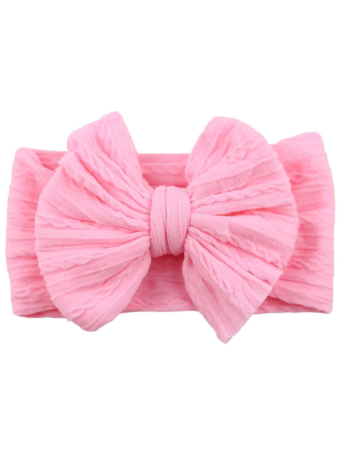 Pink headband with a large bow on a white background