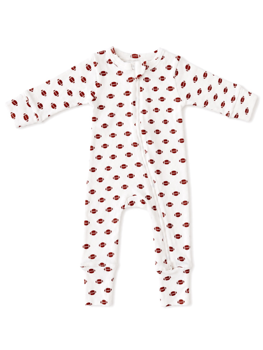 White baby onesie with brown football pattern on a white background