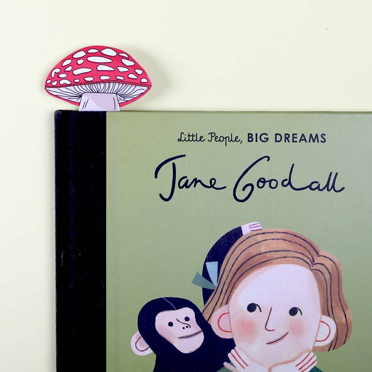 Book with 'Little People, BIG DREAMS' series on Jane Goodall, featuring a mushroom-shaped bookmark.