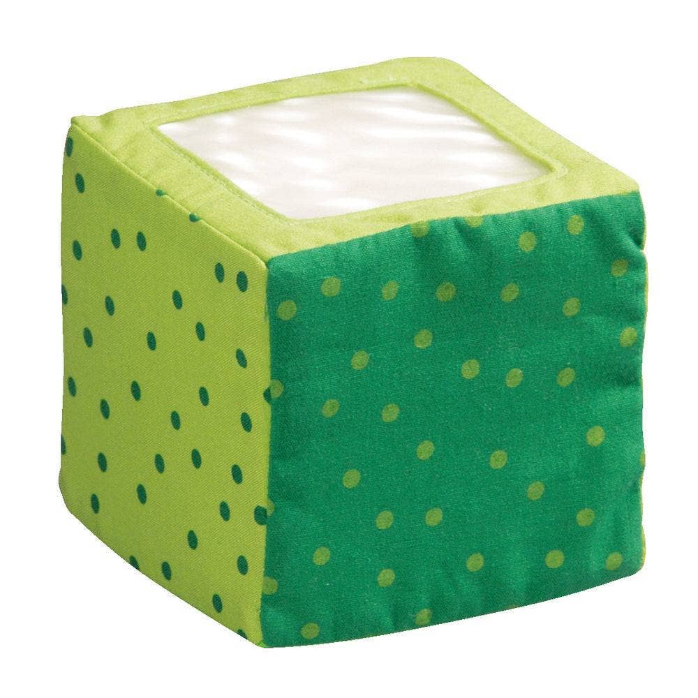 Green cube-shaped soft block with clear crinkle square on top on a white background