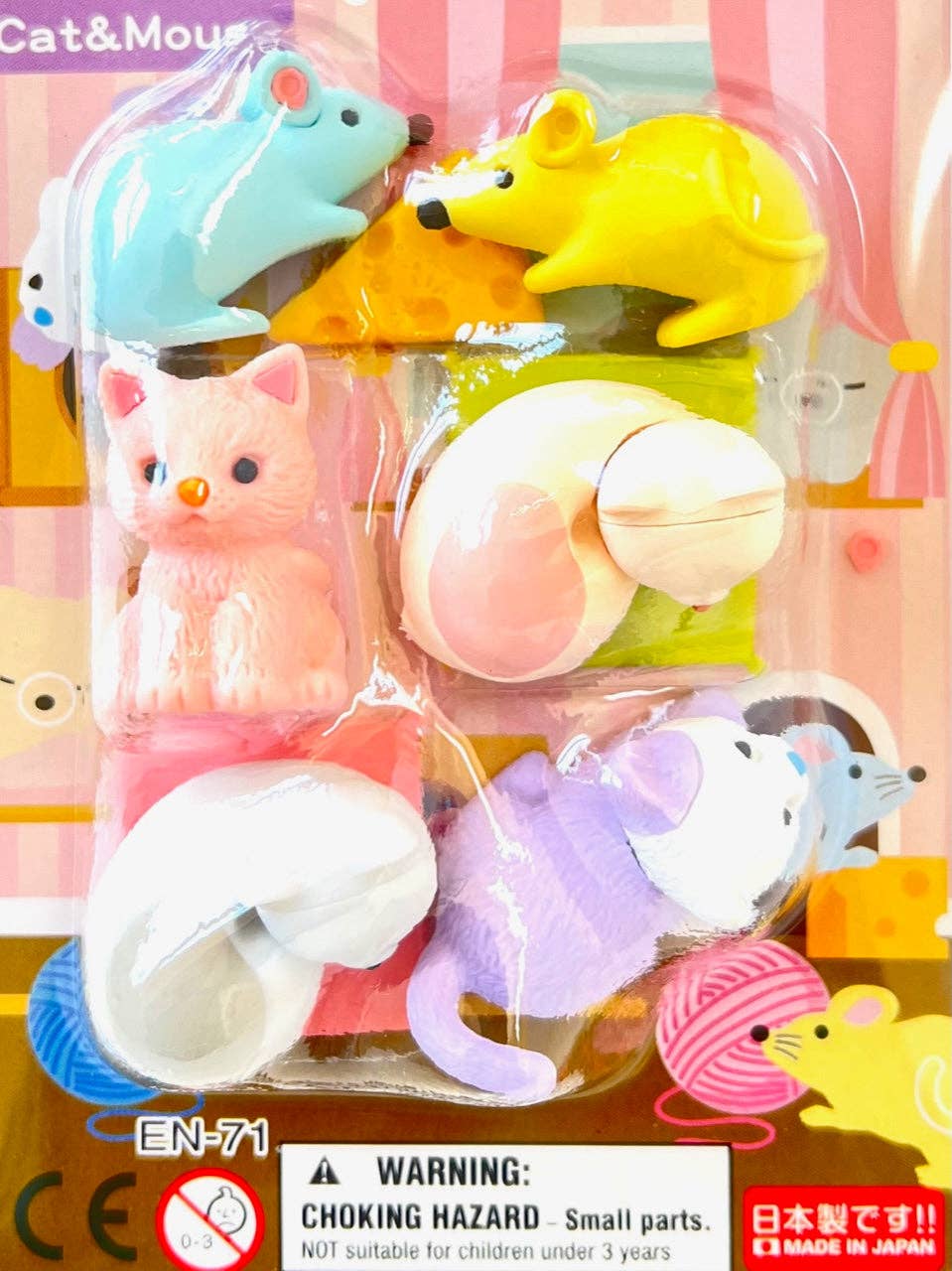 Set of colorful animal-shaped door stoppers in packaging with a warning label.