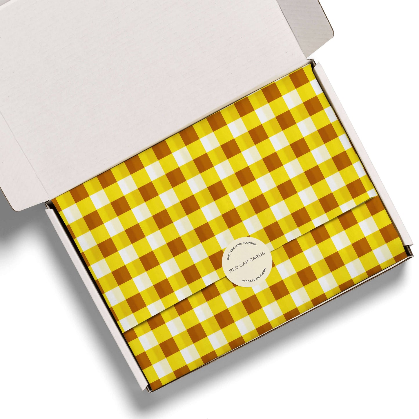 Product packaging with yellow and brown checkered pattern on a white background