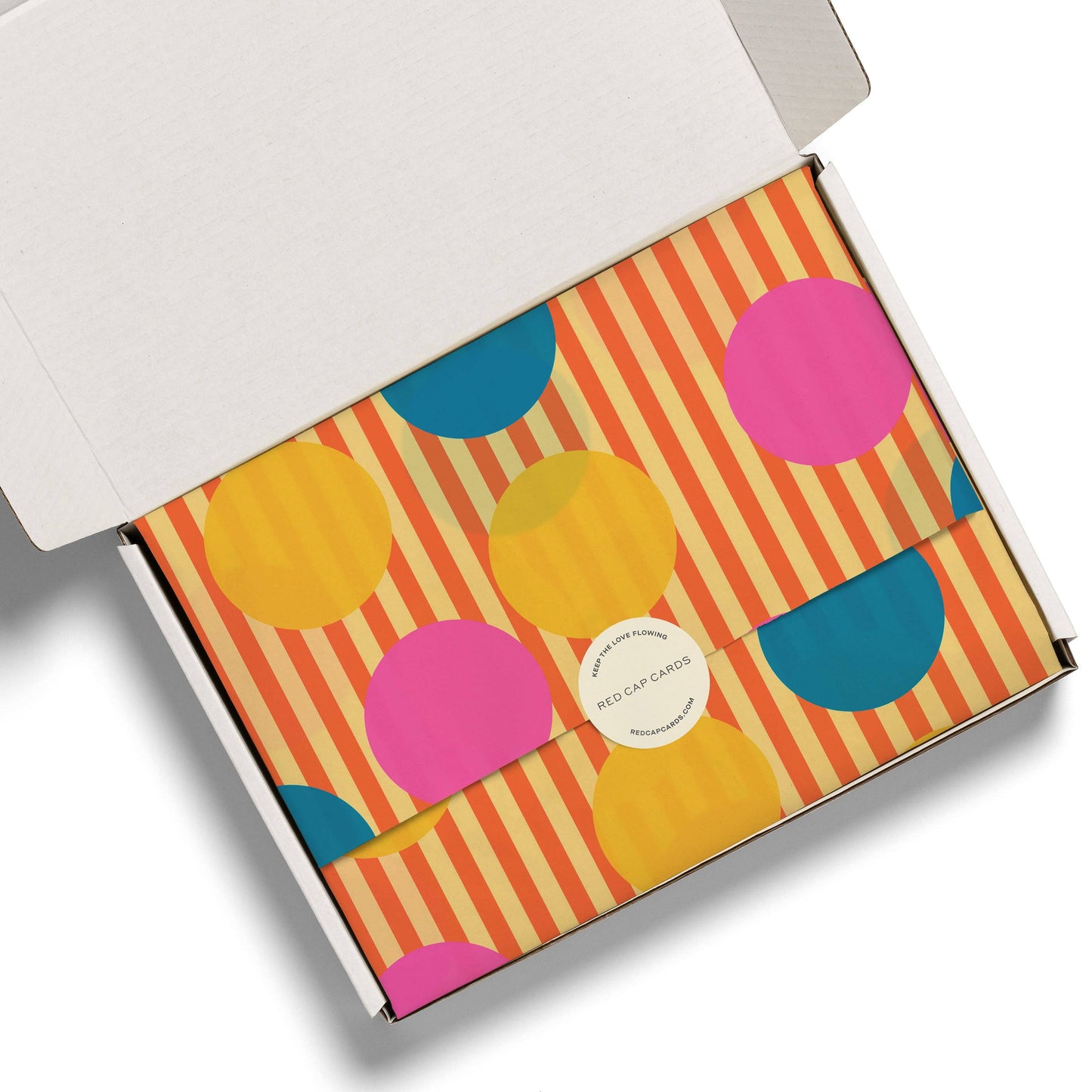 Colorful box with circular patterns on a white background