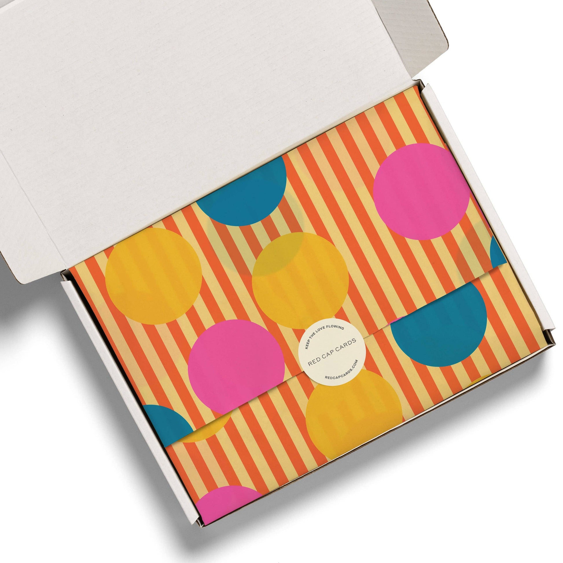 Colorful box with circular patterns on a white background